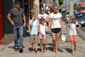 Faith Hill white printed t-shirt, black shorts, flip flops, white purse